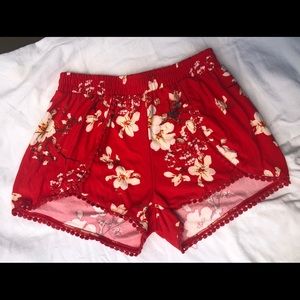 Cute red shorts with flower pattern.